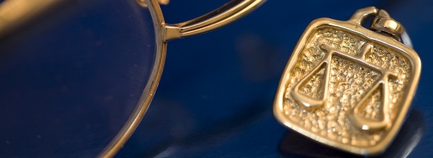 Justice scale image on a pin