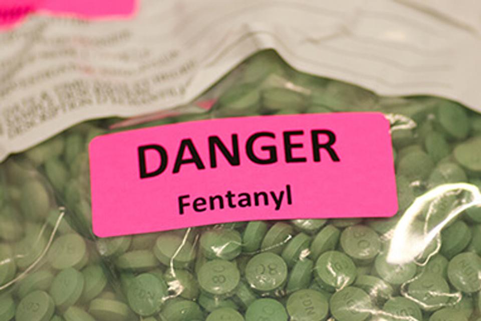 Plastic bag of green pills marked Fentanyl