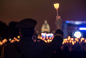 Police officer with lit candle