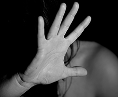 outstretched hand hiding woman's face