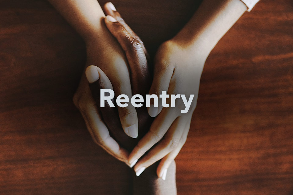 Reentry text over two people holding hands