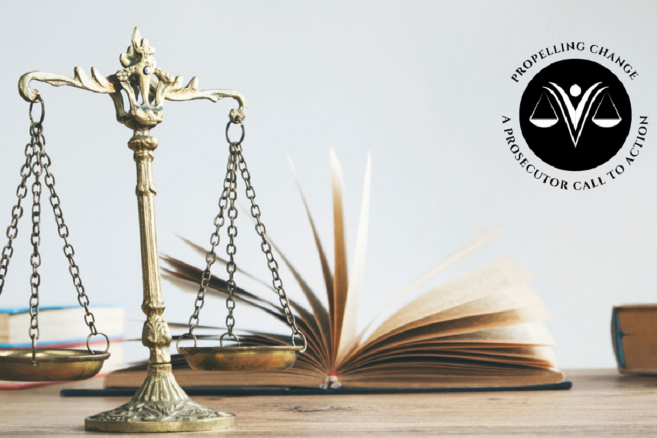 Scales and books. Logo with text Propelling Change: A Prosecutor Call to Action